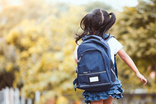 an image from the back of a young child wearing a backpack to represent Parasec's participation in Operation Backpack