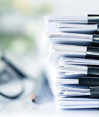 A large stack of documents to represent the document retrieval services we offer.