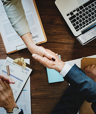 Image of hands shaking to represent the trusted relationship that comes when enlisting our registered agent services.