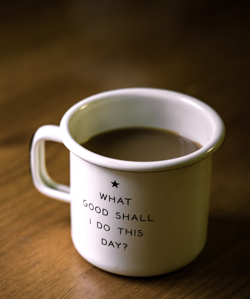 a mug with "What good shall I do this day?" written on it to represent our employee volunteer program